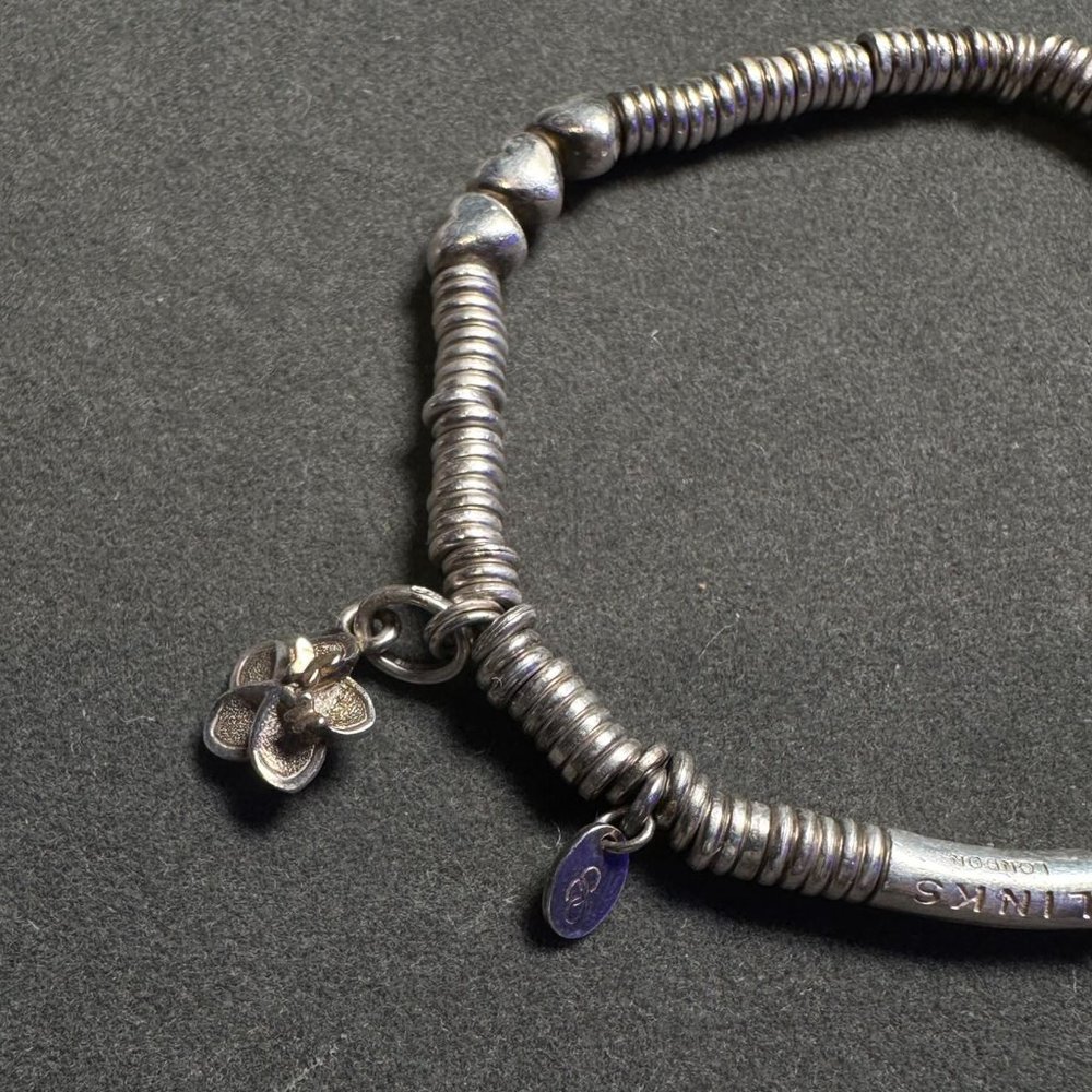 Most Classic Link of London Bracelet with 2 of $50 worth Charm
